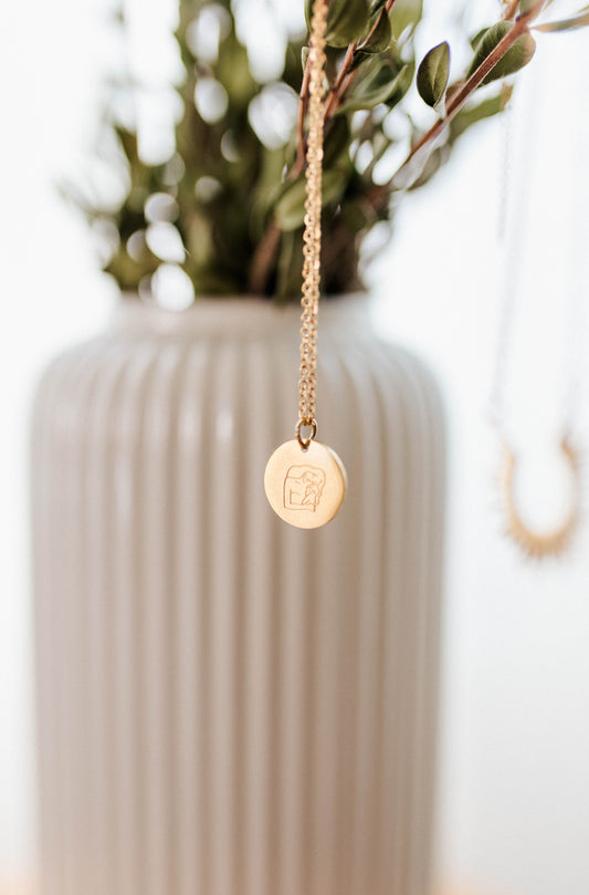 Engraved Mother Holding Baby Necklace